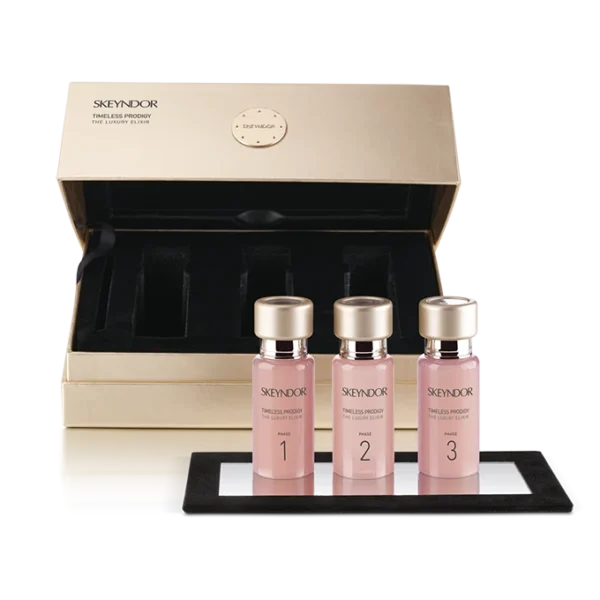 Skeyndor Timeless Prodigy Luxury Elixir - Tinh Chất Chống Lão Hóa Skeyndor Timeless Prodigy Luxury Elixir - Tinh Chất Chống Lão Hóa Hãy cùng Đẹp Meli khám phá sản phẩm chống lão hóa cao cấp đến từ thương hiệu mỹ phẩm Skeyndor, Tây Ban Nha. Với công thức chứa các thành phần hoạt chất độc quyền, sản phẩm mang lại hiệu quả vượt trội trong việc chống lão hóa, mang đến cho bạn làn da tươi trẻ, rạng rỡ. Skeyndor Timeless Prodigy Luxury Elixir - Tinh Chất Chống Lão Hóa được chế tác với sự chính xác và cẩn thận, những giọt vàng tinh túy kết hợp khoa học đỉnh cao mang đến trải nghiệm biến đổi diệu kì cho làn da Bên trong chứa hơn 15 thành phần hoạt tính mạnh, như các yếu tố tăng trưởng, proteoglycan, nấm truffle trắng và sức mạnh hồi sinh của 50 triệu tế bào gốc hoa hồng Damask để mang lại hiệu quả trẻ hóa phi thường. Xóa mờ nếp nhăn, nâng cơ da cho làn da tươi trẻ. Kích thích sản xuất collagen, elastin, tái tạo đàn hồi da. Cung cấp độ ẩm, giữ nước, mang lại làn da mềm mại Thúc đẩy quá trình phục hồi da, chữa lành tổn thương DNA Đẩy mạnh hệ thống đề kháng, bảo vệ da khỏi tác động có hại Skeyndor Timeless Prodigy Luxury Elixir có khả năng thâm nhập vào sự biểu hiện của gen da, tác động đến sự lão hóa của tế bào và phục hồi sự trẻ trung tự nhiên. Kết cấu tinh xảo chìm vào da một cách dễ dàng, để lại một lớp mịn màng như nhung Bộ trị liệu gồm 3 lọ Ampoules Ngày và Đêm, sử dụng liên tục trong 30 ngày để kích hoạt cơ chế nhịp sinh học ngày đêm của làn da. Phù hợp cho những làn da đang mệt mỏi, đã hoặc đang trên đà lão hóa, da bị chậm chuyển hóa Hướng Dẫn Sử Dụng Skeyndor Timeless Prodigy Luxury Elixir Sử dụng Skeyndor Timeless Prodigy Luxury Elixir 2 lần/ngày, vào buổi sáng và buổi tối. Bước 1: Làm sạch da Trước khi sử dụng tinh chất, cần làm sạch da mặt thật kỹ bằng sữa rửa mặt dịu nhẹ để loại bỏ bụi bẩn, bã nhờn và các lớp trang điểm còn sót lại trên da. Bước 2: Thoa toner Sau khi rửa mặt, sử dụng toner để cân bằng độ pH cho da, giúp da hấp thụ tinh chất tốt hơn. Bước 3: Thoa tinh chất Lấy một lượng tinh chất vừa đủ, thoa đều lên da mặt và cổ, massage nhẹ nhàng theo chuyển động tròn để tinh chất thẩm thấu hoàn toàn. Bước 4: Dưỡng ẩm Sau khi thoa tinh chất, sử dụng kem dưỡng ẩm để khóa ẩm cho da, giúp da luôn căng mịn, rạng rỡ. Lưu Ý Khi Sử Dụng Skeyndor Timeless Prodigy Luxury Elixir: Sản phẩm phù hợp với mọi loại da, kể cả da nhạy cảm. Bảo quản sản phẩm nơi khô ráo, thoáng mát, tránh ánh nắng trực tiếp. Skeyndor Timeless Prodigy Luxury Elixir là sản phẩm chống lão hóa cao cấp, mang lại hiệu quả vượt trội trong việc chống lão hóa đa chiều, giúp da trẻ hóa toàn diện. Với hướng dẫn sử dụng chi tiết trên đây, hy vọng bạn sẽ sử dụng sản phẩm hiệu quả và an toàn. Skeyndor Timeless Prodigy Luxury Elixir - Tinh Chất Chống Lão Hóa được chế tác với sự chính xác và cẩn thận, những giọt vàng tinh túy kết hợp khoa học đỉnh cao mang đến trải nghiệm biến đổi diệu kì cho làn da. Bên trong chứa hơn 15 thành phần hoạt tính mạnh, như các yếu tố tăng trưởng, Proteoglycan, nấm Truffle trắng và sức mạnh hồi sinh của 50 triệu tế bào gốc hoa hồng Damask để mang lại hiệu quả trẻ hóa phi thường. Xóa mờ nếp nhăn, nâng cơ da cho làn da tươi trẻ. Kích thích sản xuất collagen, elastin, tái tạo đàn hồi da. Cung cấp độ ẩm, giữ nước, mang lại làn da mềm mại Thúc đẩy quá trình phục hồi da, chữa lành tổn thương DNA Đẩy mạnh hệ thống đề kháng, bảo vệ da khỏi tác động có hại Xuất xứ : Skeyndor Spain – Tây Ban Nha Skeyndor Timeless Prodigy Luxury Elixir - Tinh Chất Chống Lão Hóa depmeli